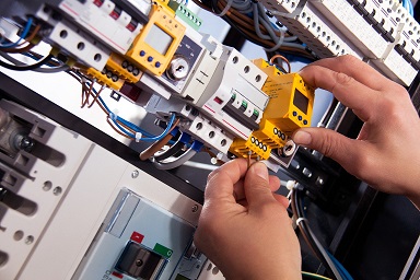 An electrician is checking the circuits.